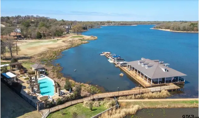 aerial view of a house with a lake view