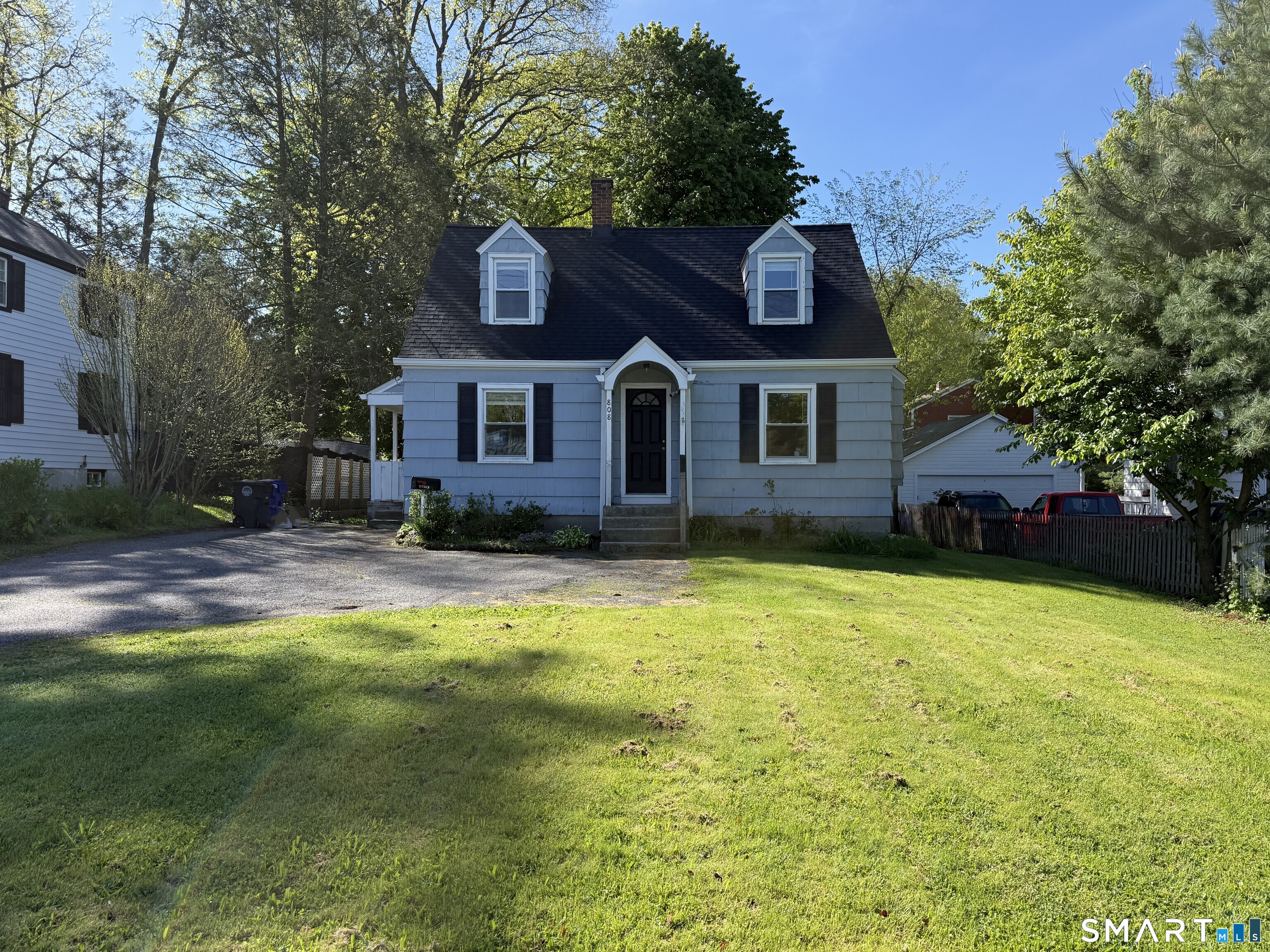 808 East Main Street Torrington, CT 06790 - Photo 1 of 40 a front view of a house with a yard