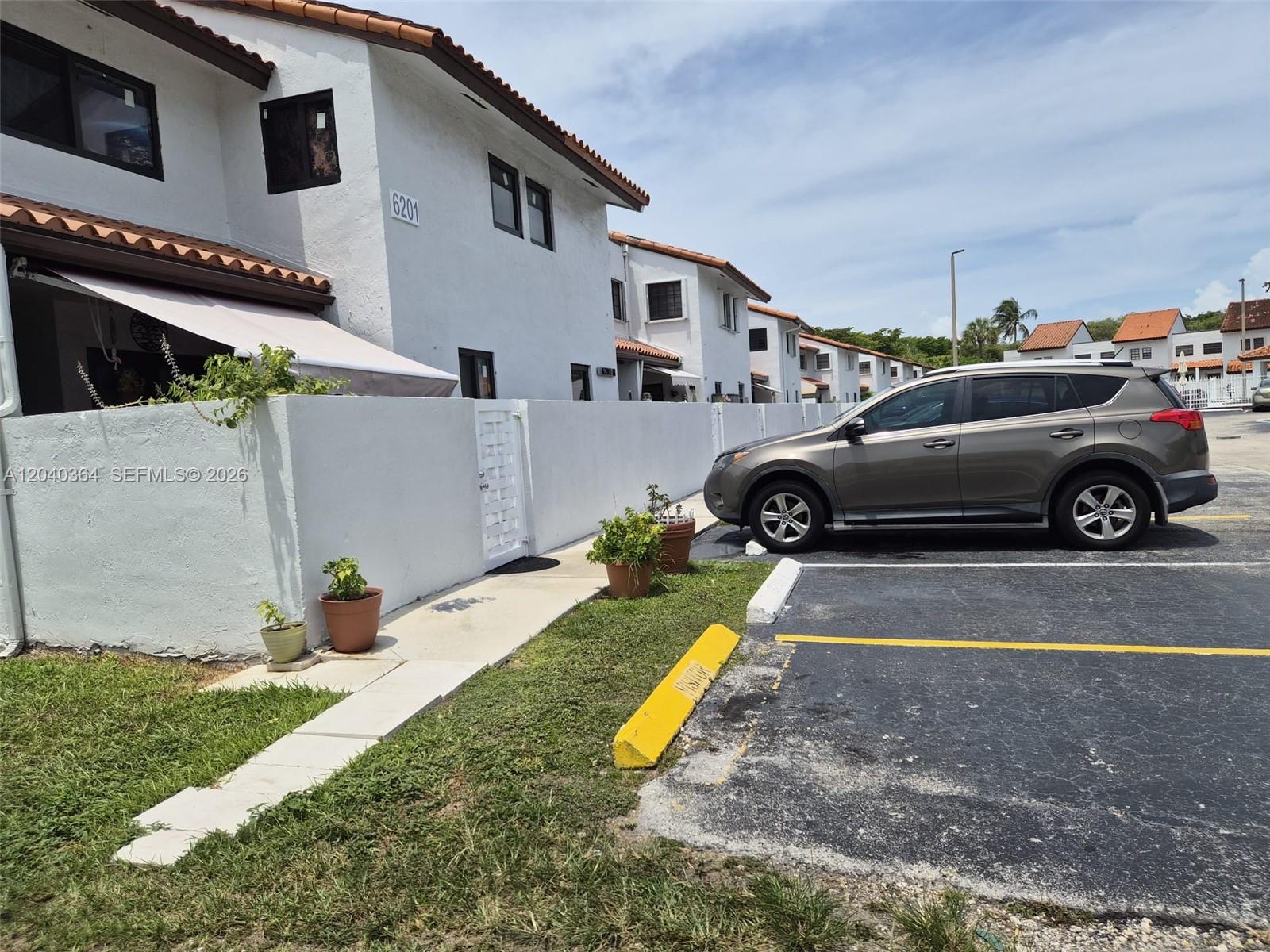 6201 Southwest 138th Court Miami, FL 33183 - Photo 1 of 7 a view of a car in front of a house