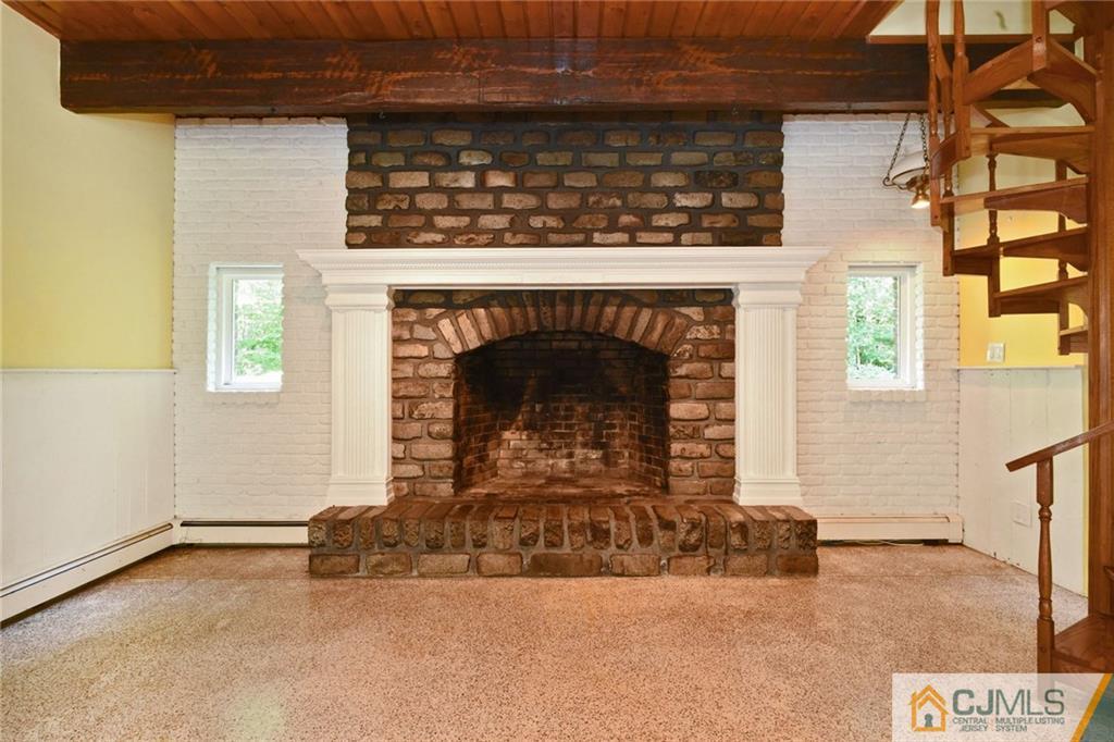 59 Spring Hill Road Old Bridge, NJ 07747 - Photo 11 of 24 a living room with a fireplace