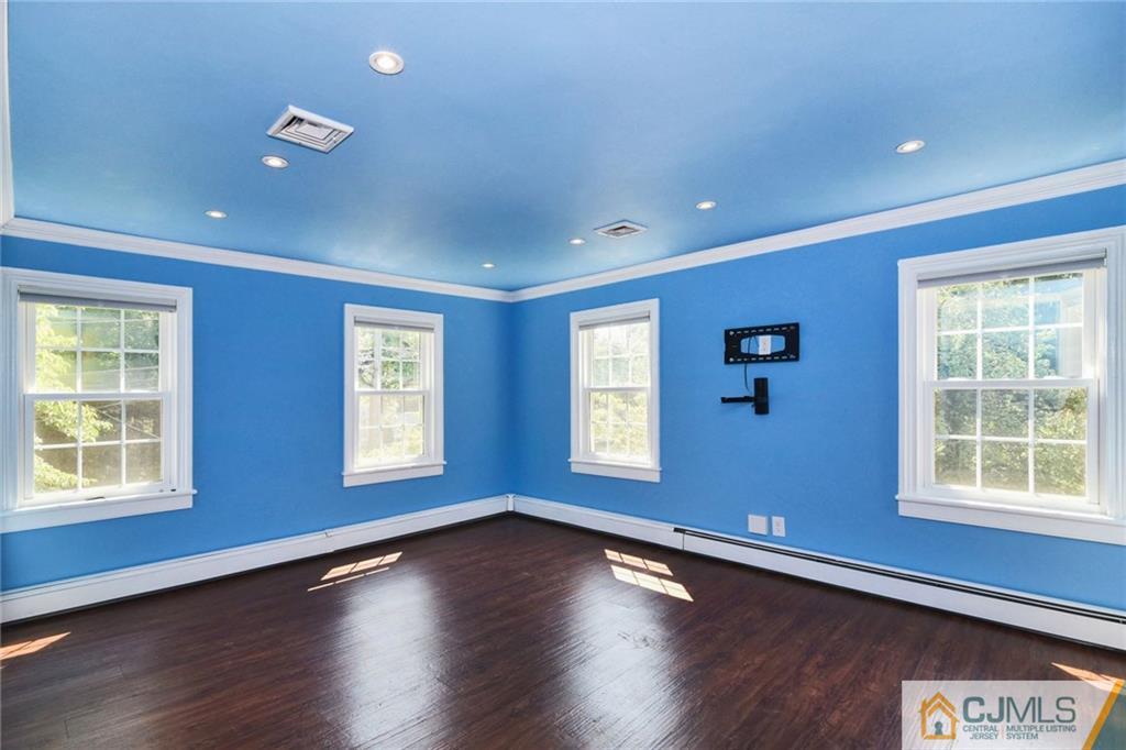 59 Spring Hill Road Old Bridge, NJ 07747 - Photo 13 of 24 a view of an empty room with wooden floor and a window