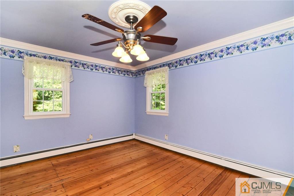 59 Spring Hill Road Old Bridge, NJ 07747 - Photo 14 of 24 a view of a room with a window and wooden floor