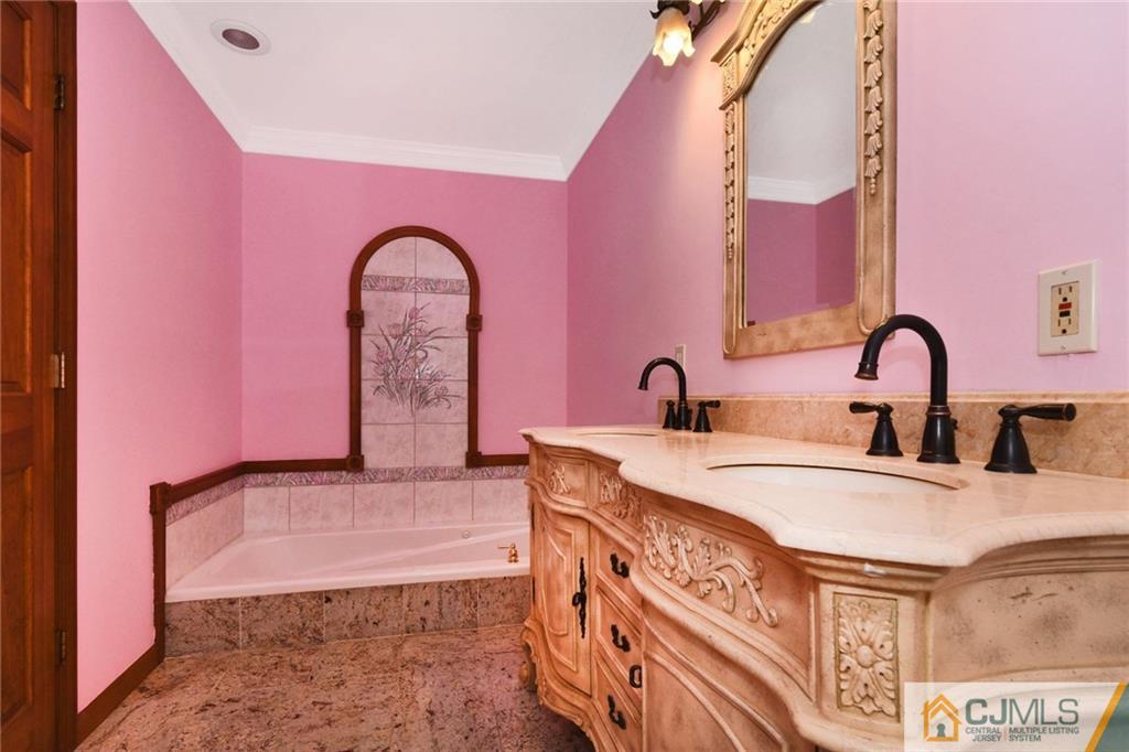59 Spring Hill Road Old Bridge, NJ 07747 - Photo 20 of 24 a spacious bathroom with a sink a mirror and shower