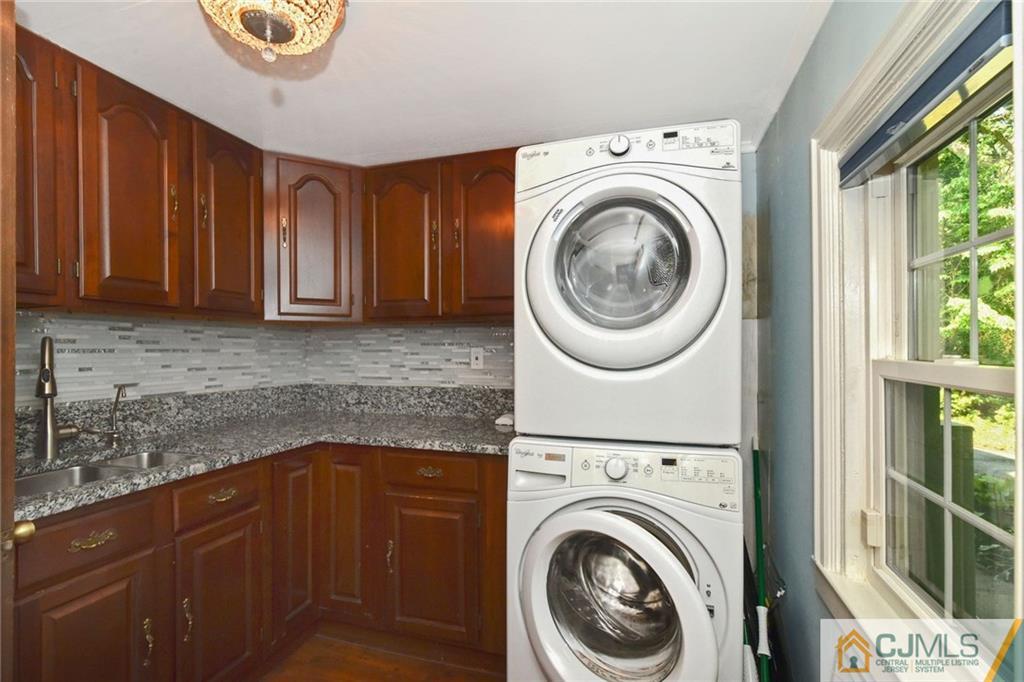 59 Spring Hill Road Old Bridge, NJ 07747 - Photo 21 of 24 a utility room with sink dryer and washer
