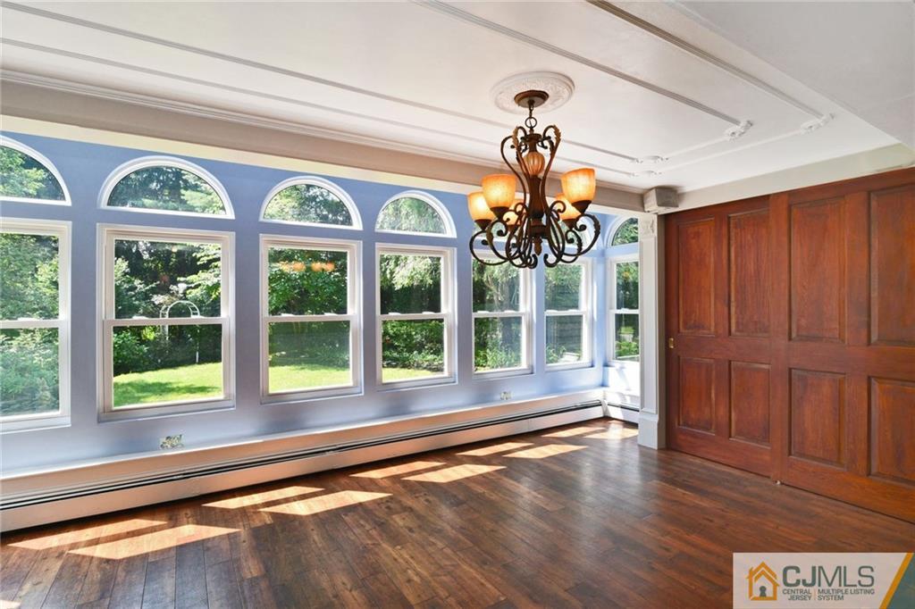 59 Spring Hill Road Old Bridge, NJ 07747 - Photo 6 of 24 a view of a room with wooden floor and windows
