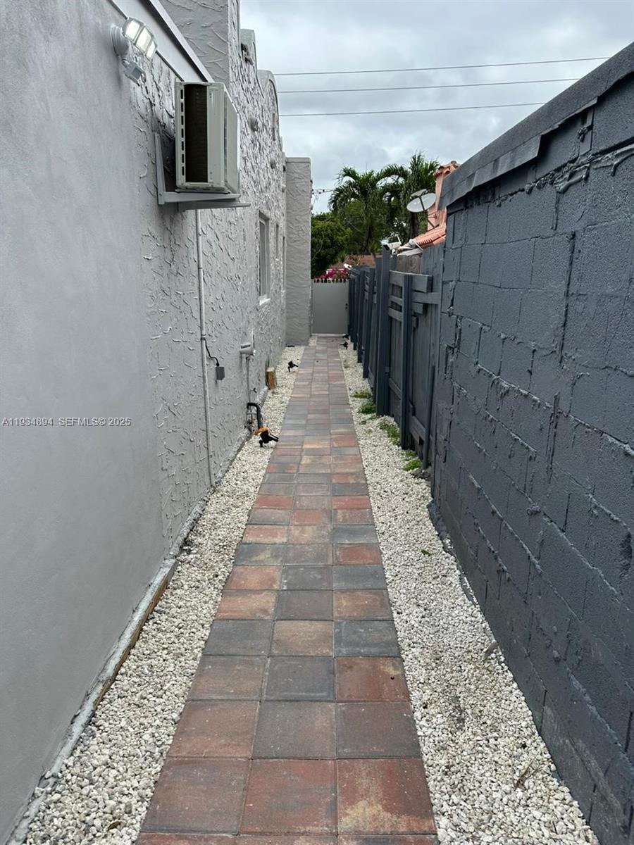1822 Northwest 4th Street, Unit C Miami, FL 33125 - Photo 6 of 7 a view of a pathway with a patio