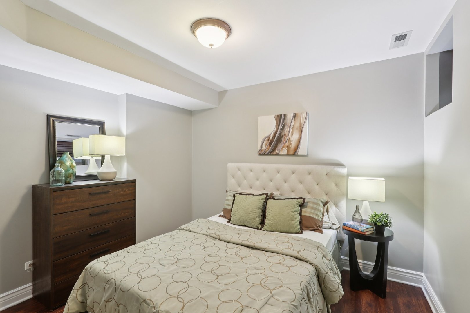 3733 North Damen Avenue, Unit 1 Chicago, IL 60613 - Photo 13 of 14 a bedroom with a bed and a dresser