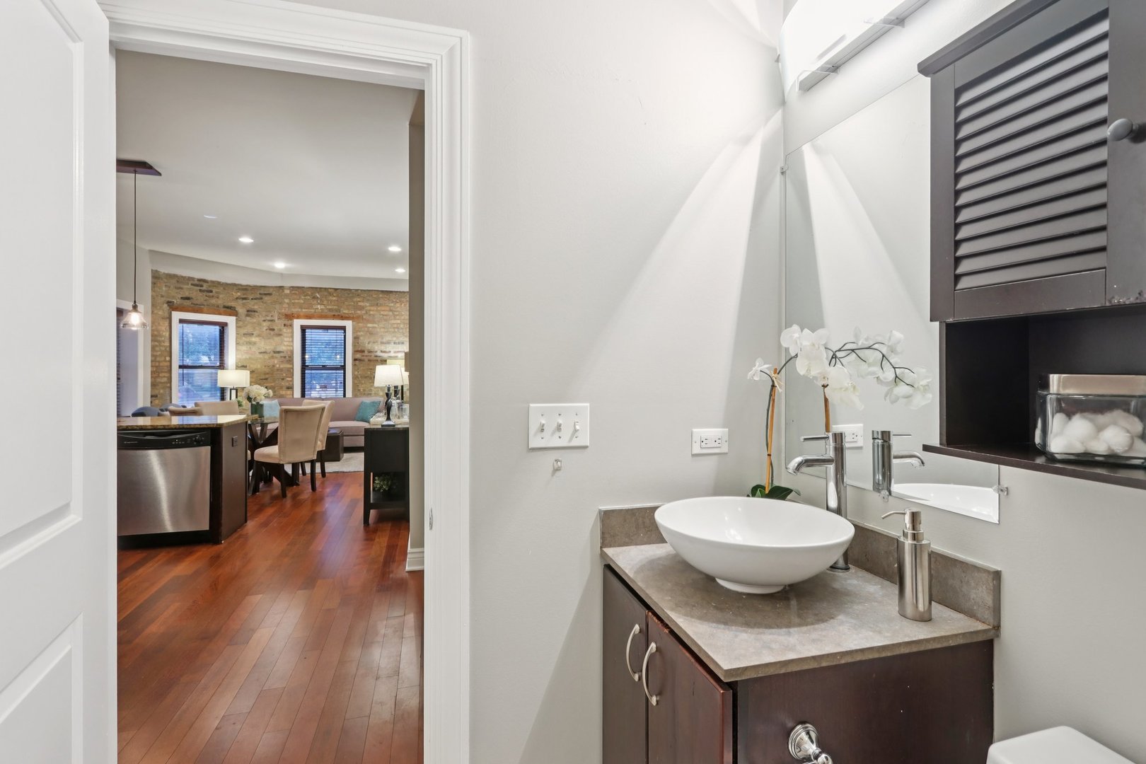 3733 North Damen Avenue, Unit 1 Chicago, IL 60613 - Photo 7 of 14 a view of a dining room with furniture and wooden floor