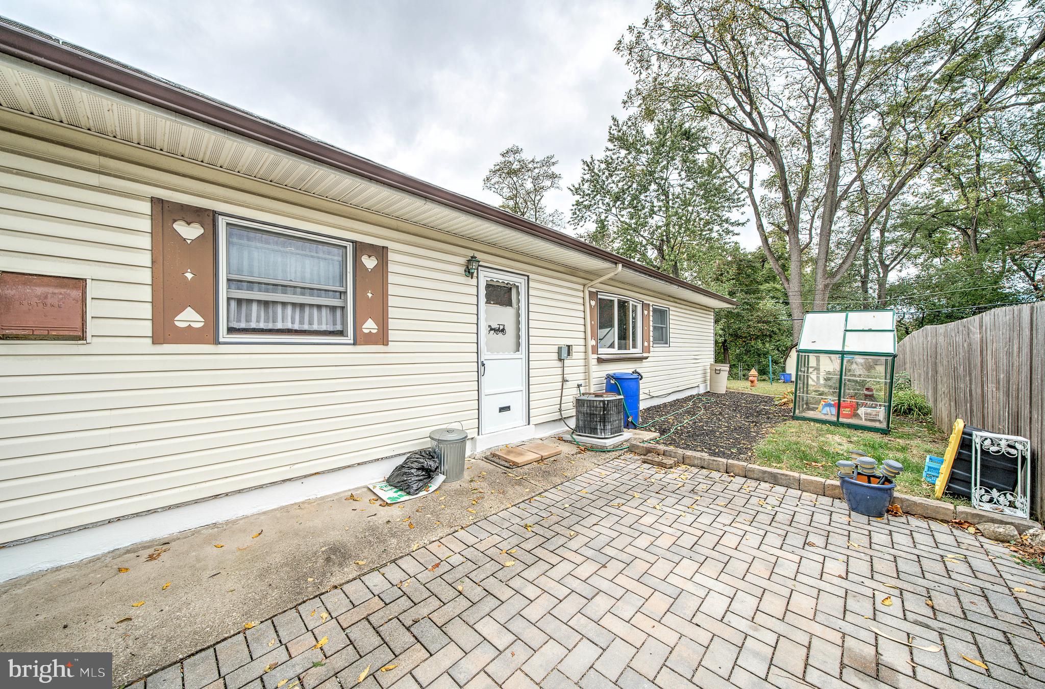 9346 Rising Sun Avenue Philadelphia, PA 19115 - Photo 22 of 28 brick driveway and side yard