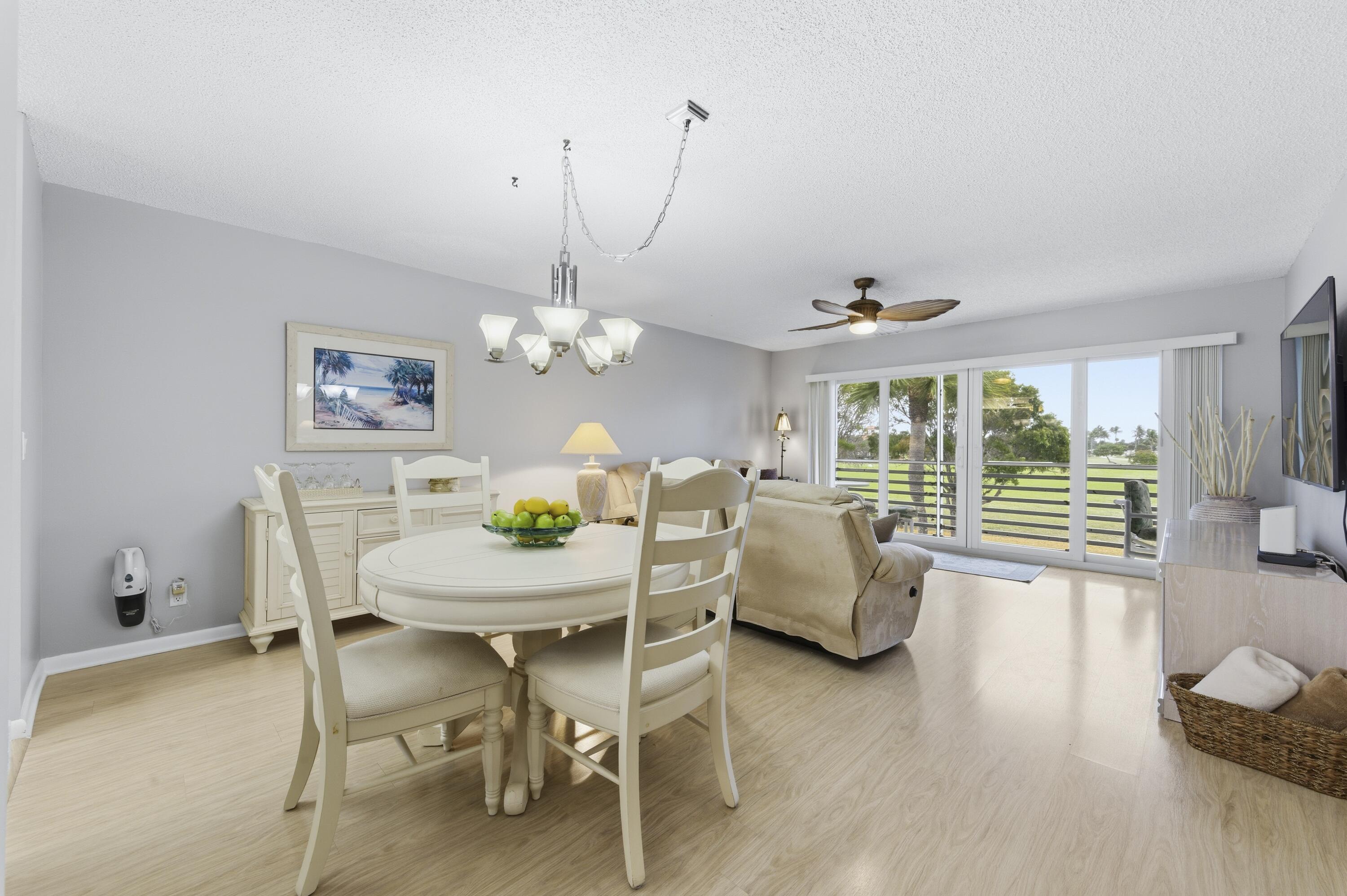 717 Highway 1, Unit 707 Jupiter, FL 33477 - Photo 13 of 33 a view of a livingroom with furniture window and wooden floor