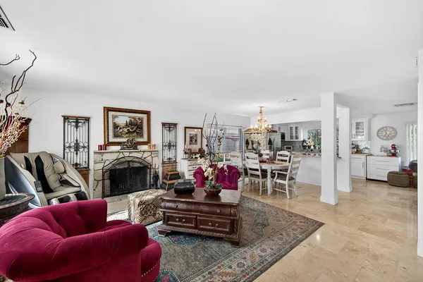 a living room with furniture or couch and a fireplace
