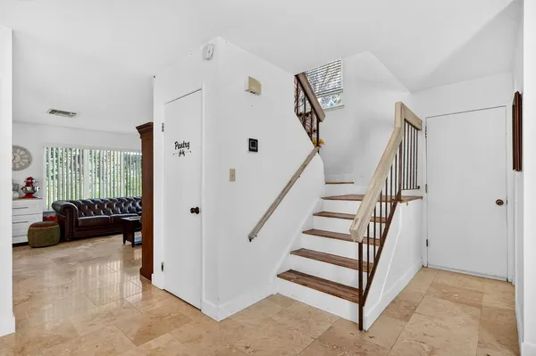 a view of entryway with livingroom and stairs