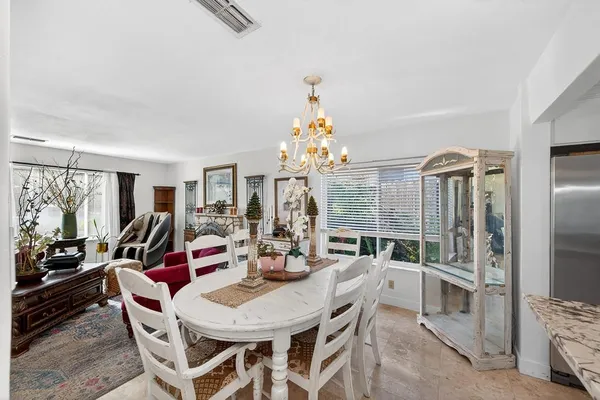 a view of a dining room with furniture window and outside view