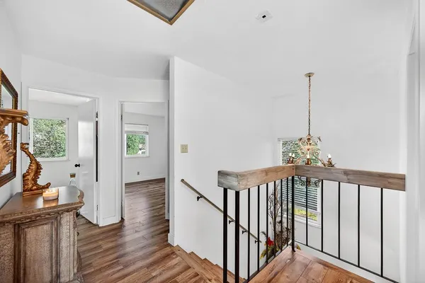 a view of front door with wooden floor