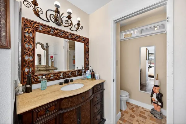 a bathroom with a sink double vanity and a mirror