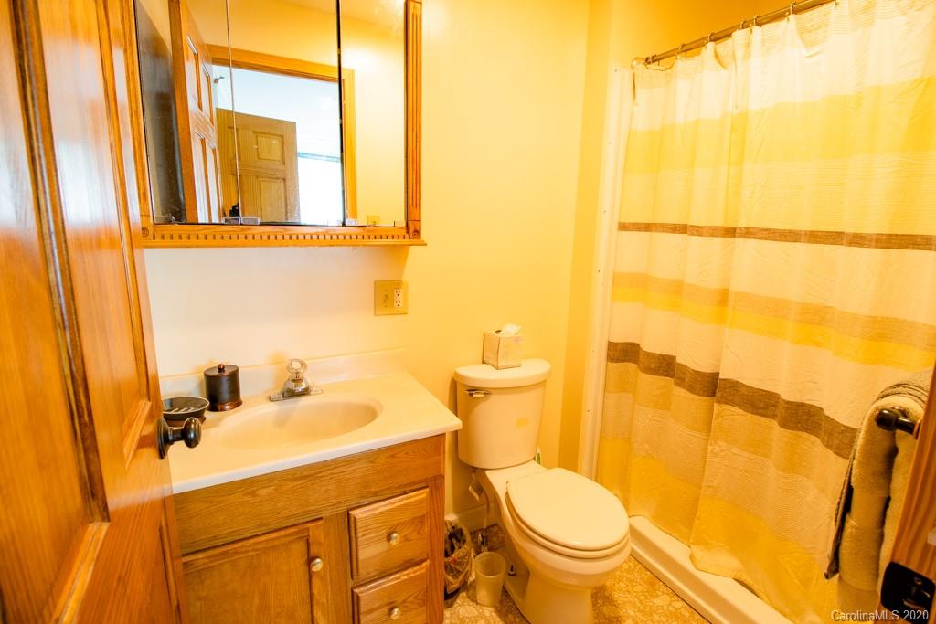 1271 Upper Brush Creek Road Fairview, NC 28730 - Photo 12 of 19 a bathroom with a sink and a toilet