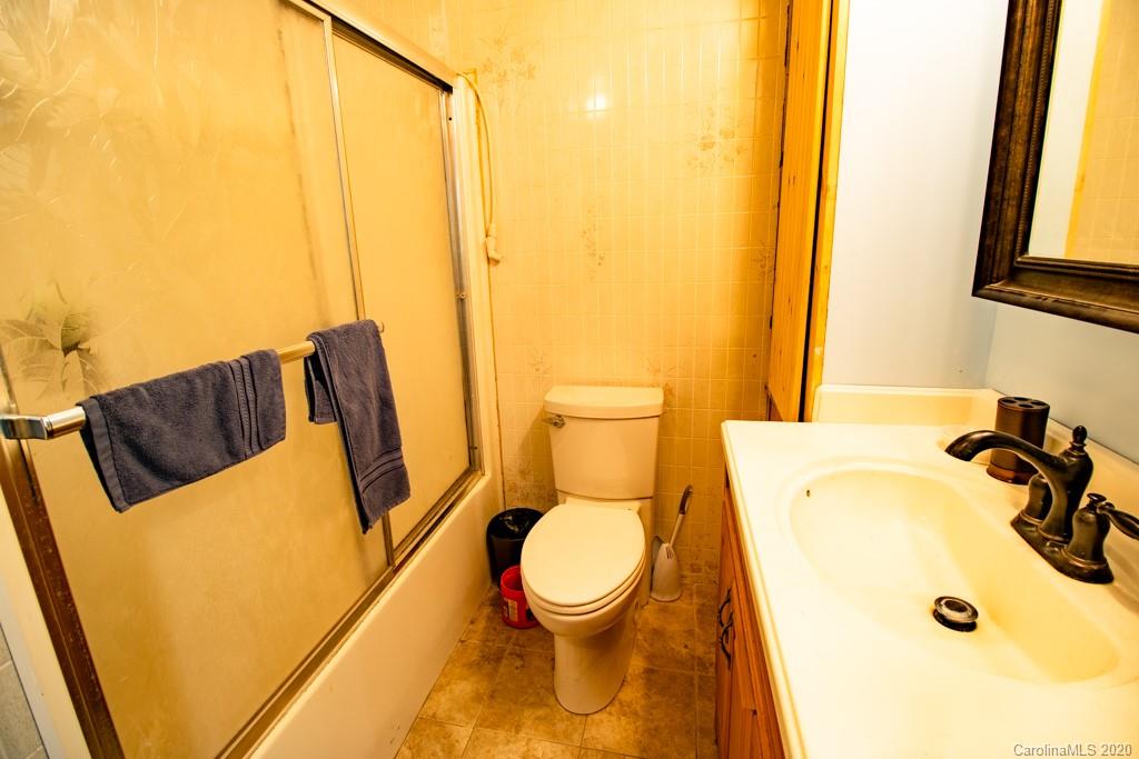 1271 Upper Brush Creek Road Fairview, NC 28730 - Photo 16 of 19 a bathroom with a sink and a toilet