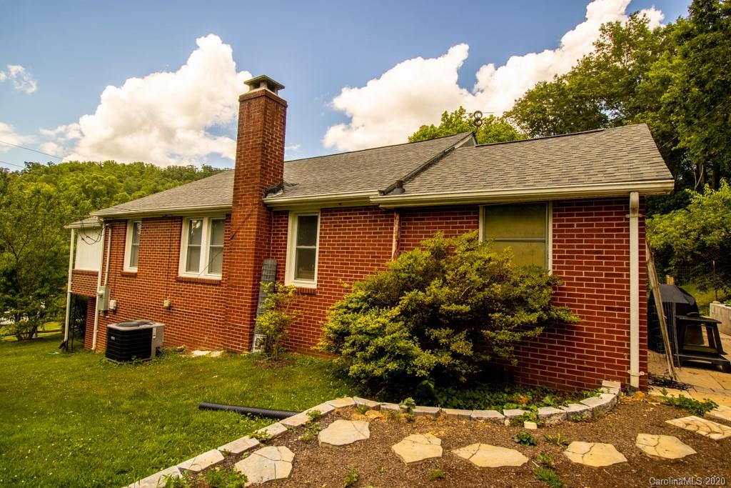 1271 Upper Brush Creek Road Fairview, NC 28730 - Photo 3 of 19 a front view of a house with garden