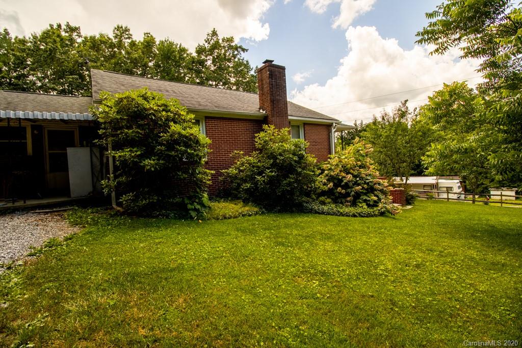 1271 Upper Brush Creek Road Fairview, NC 28730 - Photo 4 of 19 a view of a house with a backyard