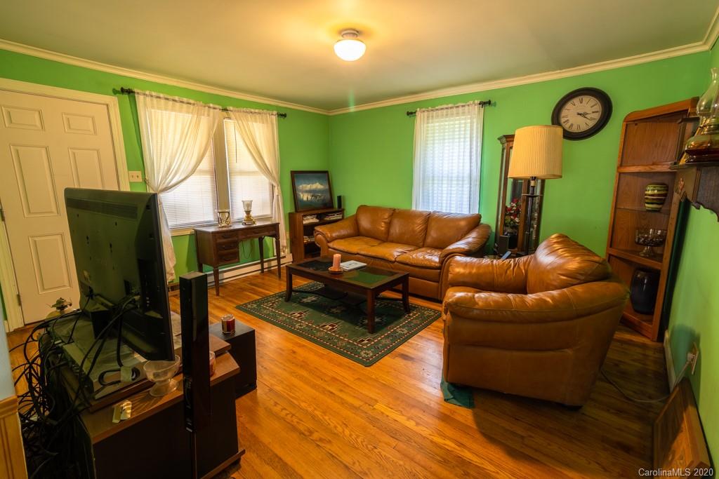 1271 Upper Brush Creek Road Fairview, NC 28730 - Photo 9 of 19 a living room with furniture and a window