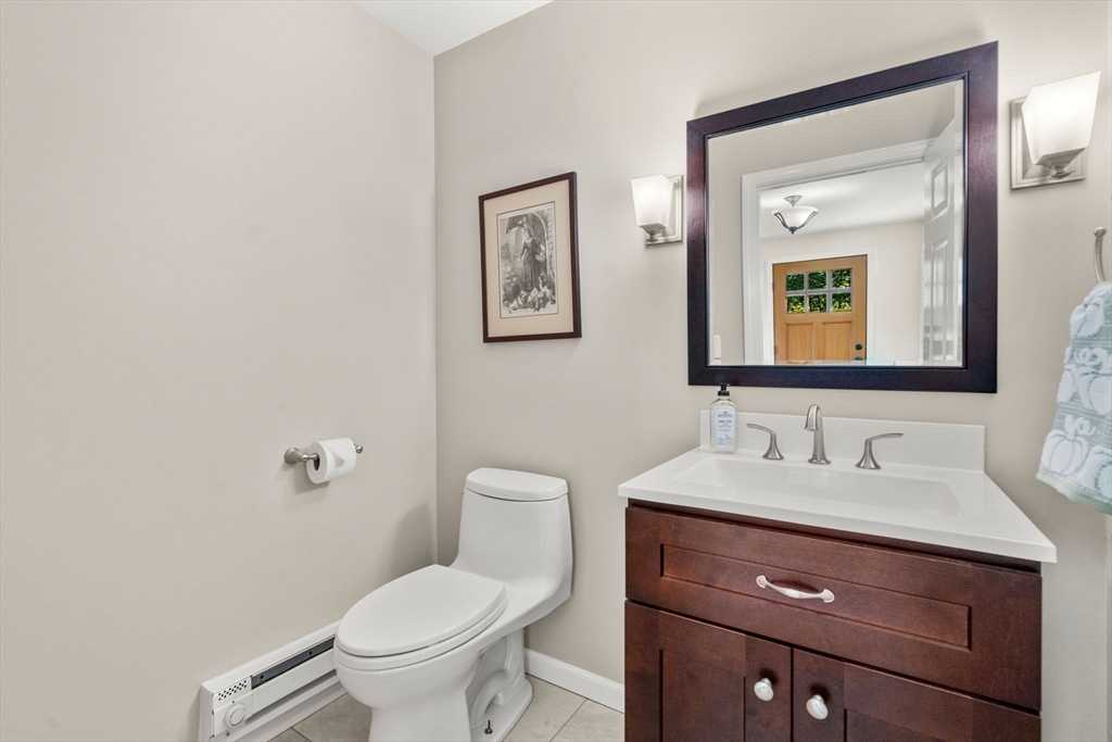 216 Old Littleton Road Harvard, MA 01451 - Photo 18 of 34 a bathroom with a toilet sink and mirror