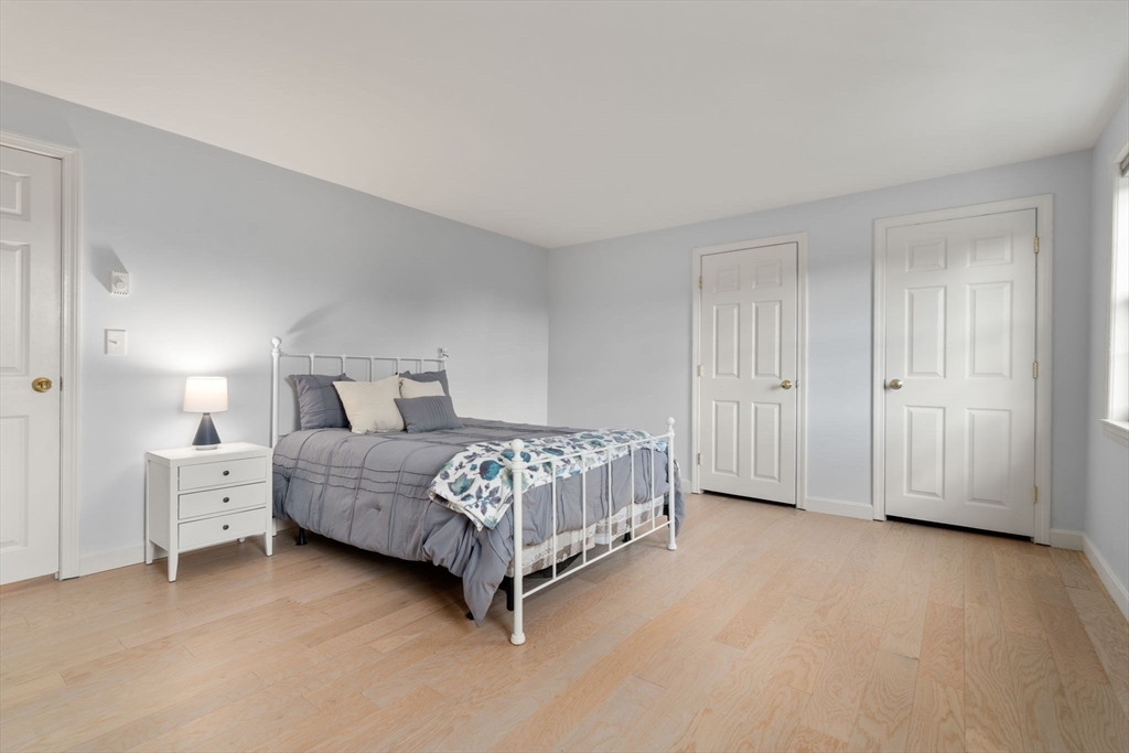 216 Old Littleton Road Harvard, MA 01451 - Photo 22 of 34 a bedroom with a bed and a night stand