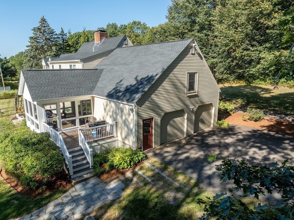 216 Old Littleton Road Harvard, MA 01451 - Photo 31 of 34 a view of house with garden and tall trees