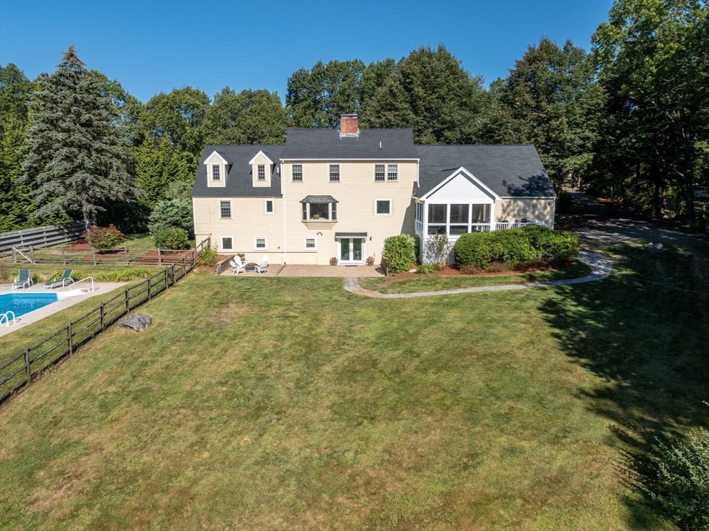 216 Old Littleton Road Harvard, MA 01451 - Photo 32 of 34 a view of a house with a big yard and large tree