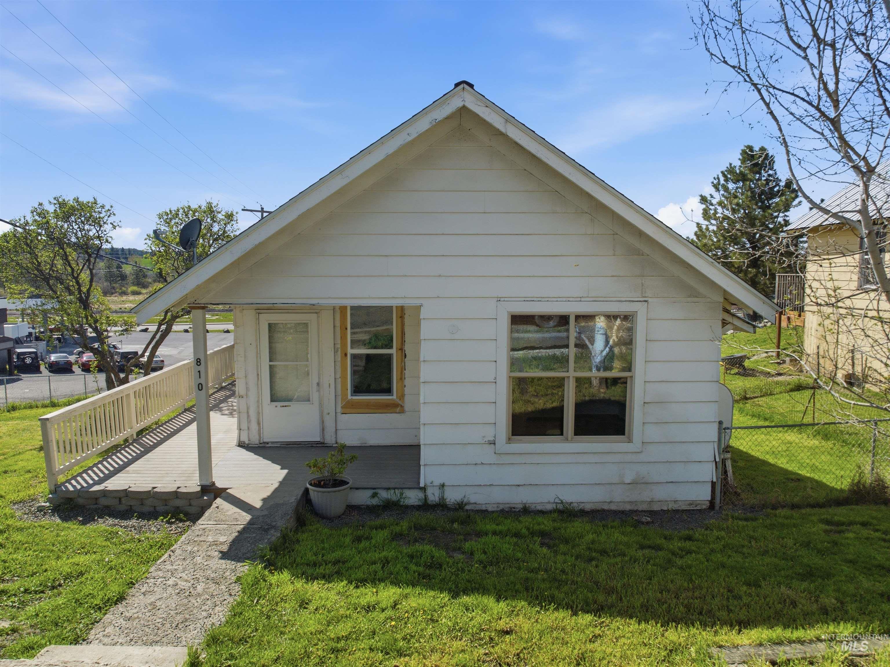 White siding exterior with a pitched roof