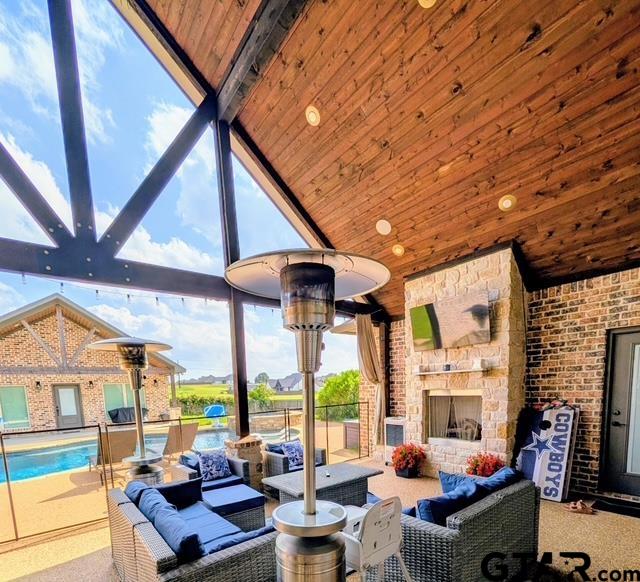 225 Clements Circle Tatum, TX 75691 - Photo 14 of 26 a living room with fireplace furniture and a large window