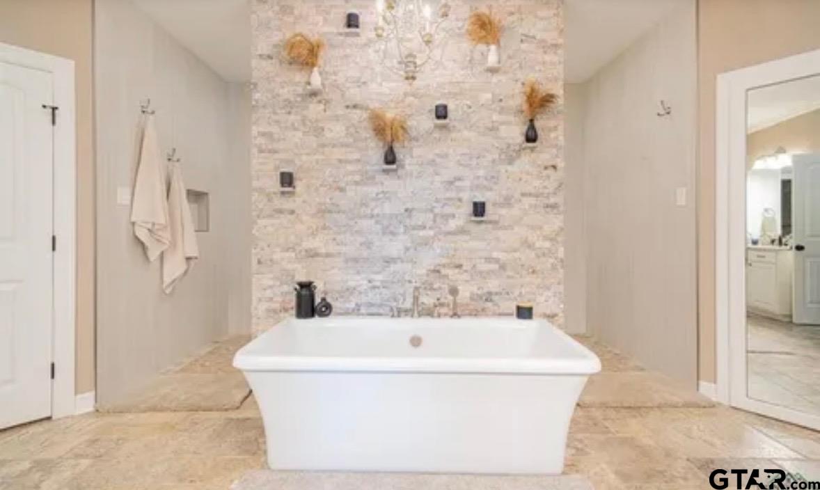 225 Clements Circle Tatum, TX 75691 - Photo 18 of 26 a bathroom with a bathtub