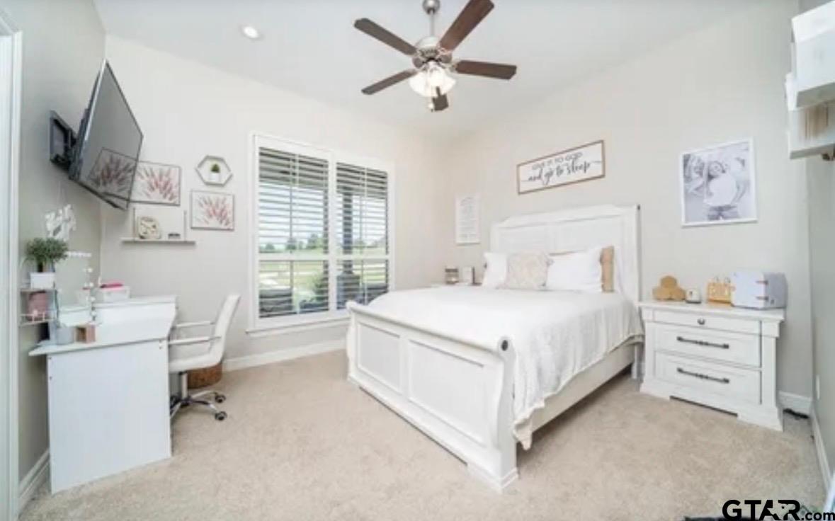 225 Clements Circle Tatum, TX 75691 - Photo 23 of 26 a bed room with a bed and a window
