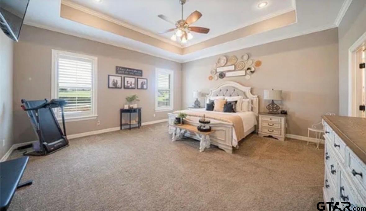 225 Clements Circle Tatum, TX 75691 - Photo 24 of 26 a bedroom with furniture and a chandelier