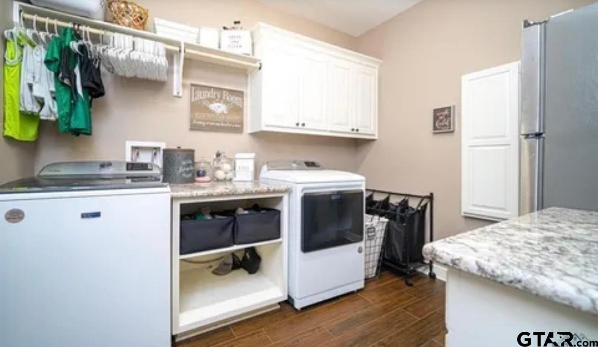 225 Clements Circle Tatum, TX 75691 - Photo 26 of 26 a kitchen with a sink stove and wooden floor