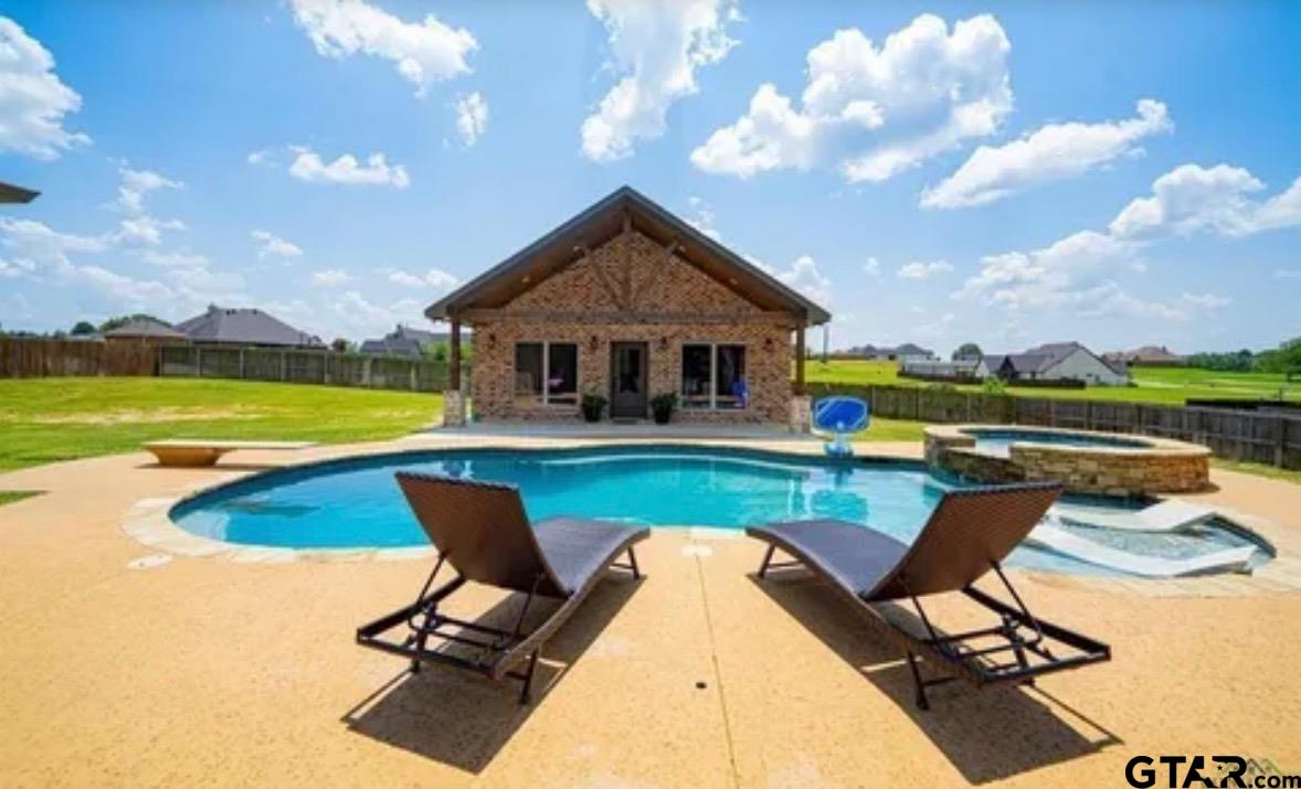225 Clements Circle Tatum, TX 75691 - Photo 3 of 26 a view of swimming pool with lounge chair