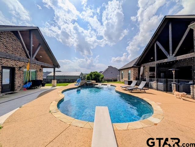 225 Clements Circle Tatum, TX 75691 - Photo 4 of 26 a view of a swimming pool with sitting area