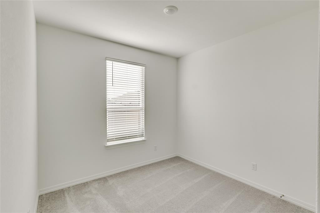 109 Bridge Deck Loop Kyle, TX 78640 - Photo 15 of 40 Unfurnished room with light colored carpet and baseboards