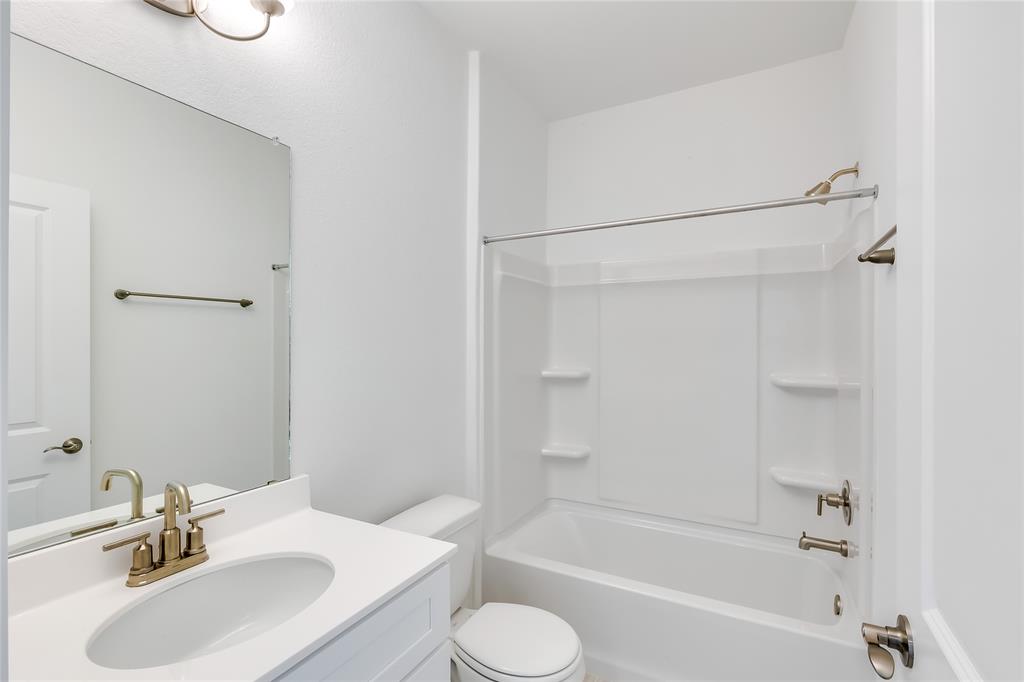 109 Bridge Deck Loop Kyle, TX 78640 - Photo 16 of 40 Bathroom featuring vanity and tub / shower combination