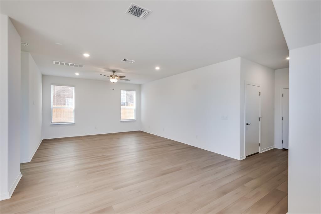 109 Bridge Deck Loop Kyle, TX 78640 - Photo 17 of 40 Unfurnished room featuring light wood finished floors, recessed lighting, and ceiling fan