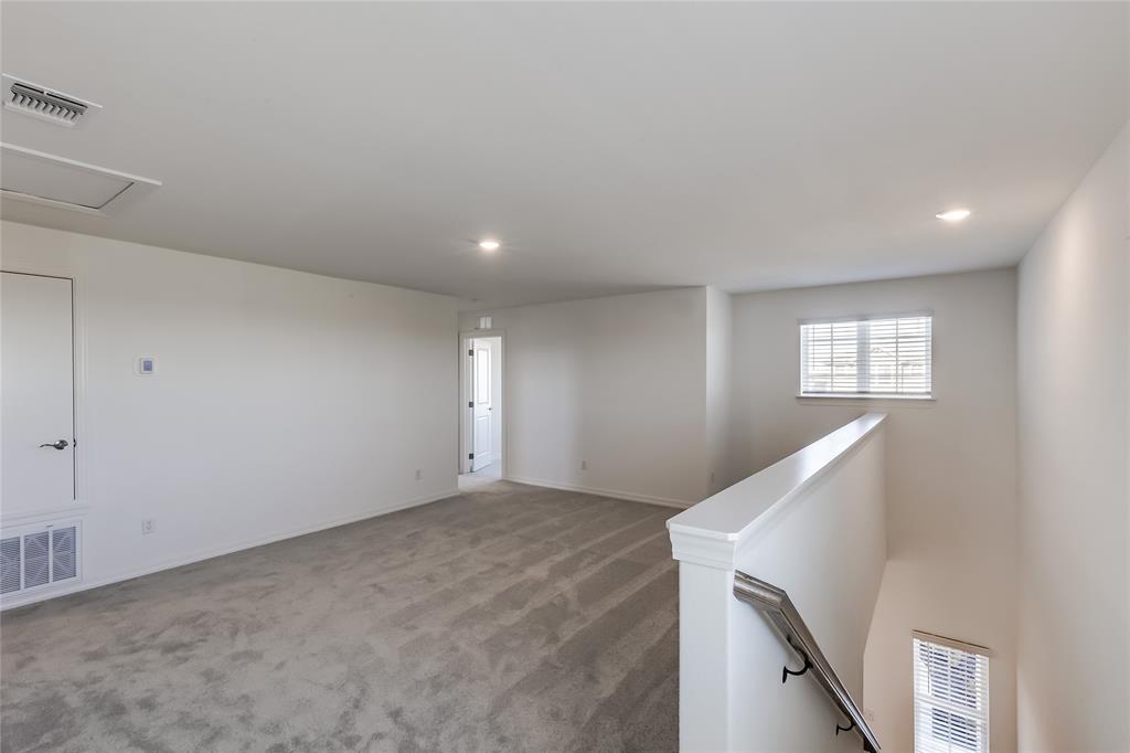109 Bridge Deck Loop Kyle, TX 78640 - Photo 18 of 40 Carpeted spare room featuring recessed lighting