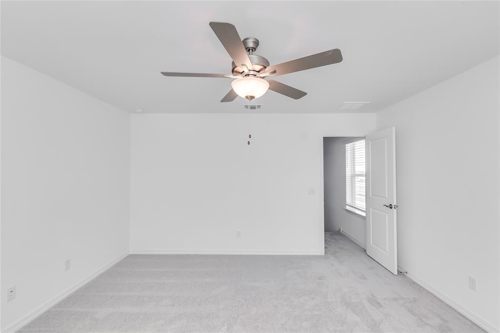 109 Bridge Deck Loop Kyle, TX 78640 - Photo 20 of 40 Spare room featuring light colored carpet and a ceiling fan