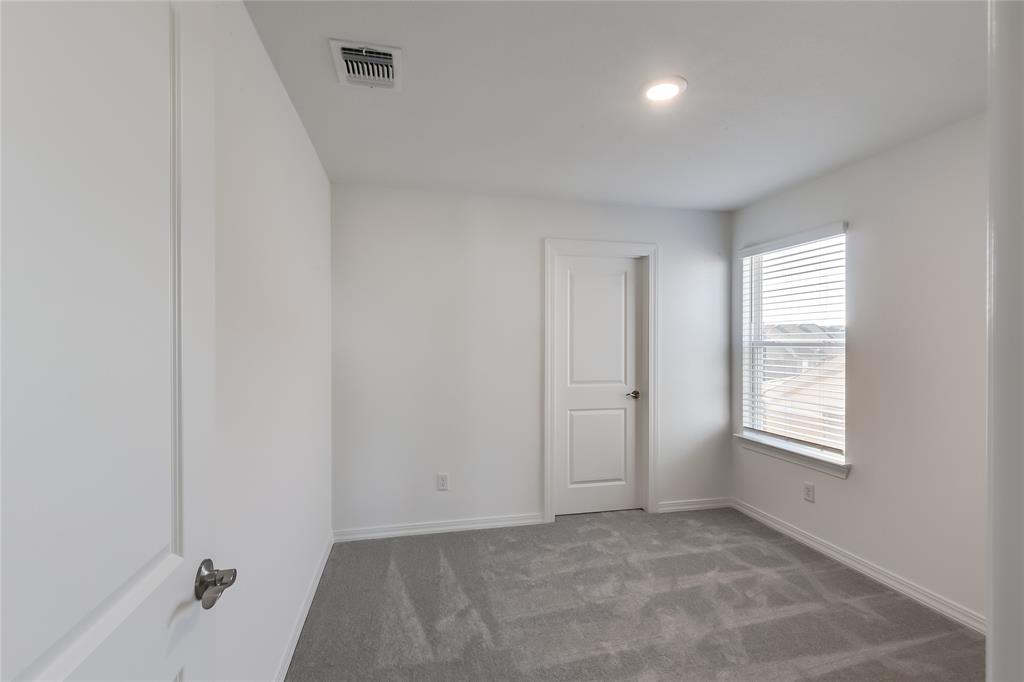 109 Bridge Deck Loop Kyle, TX 78640 - Photo 24 of 40 Spare room with carpet floors and recessed lighting
