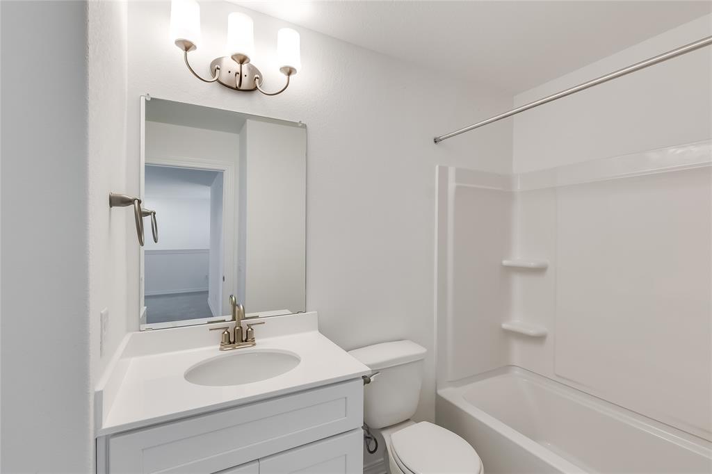 109 Bridge Deck Loop Kyle, TX 78640 - Photo 25 of 40 Full bathroom featuring vanity and shower / bath combination