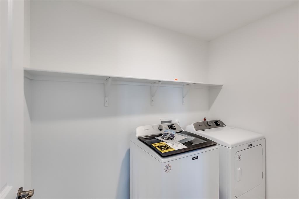109 Bridge Deck Loop Kyle, TX 78640 - Photo 27 of 40 Laundry area featuring washing machine and clothes dryer
