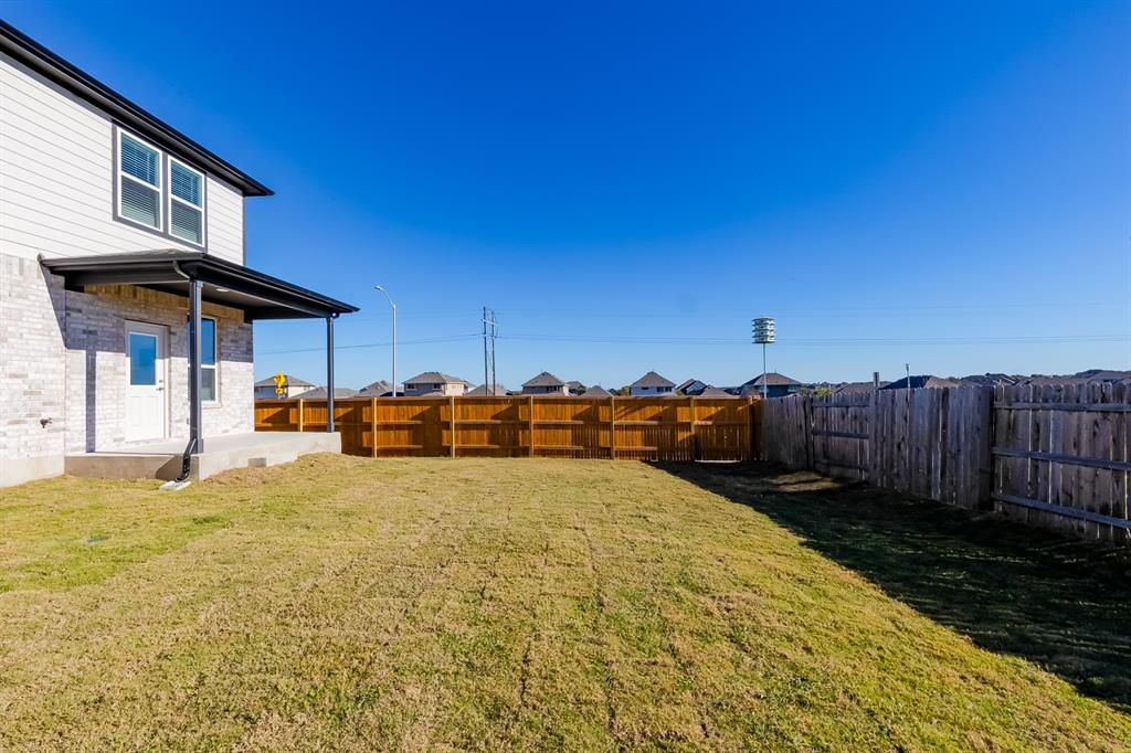 109 Bridge Deck Loop Kyle, TX 78640 - Photo 32 of 40 Fenced backyard with a patio area
