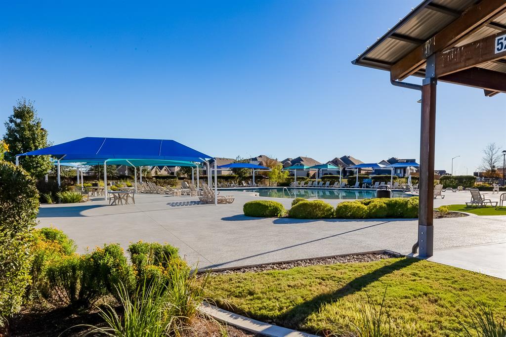 109 Bridge Deck Loop Kyle, TX 78640 - Photo 40 of 40 View of jungle gym with a patio and a community pool