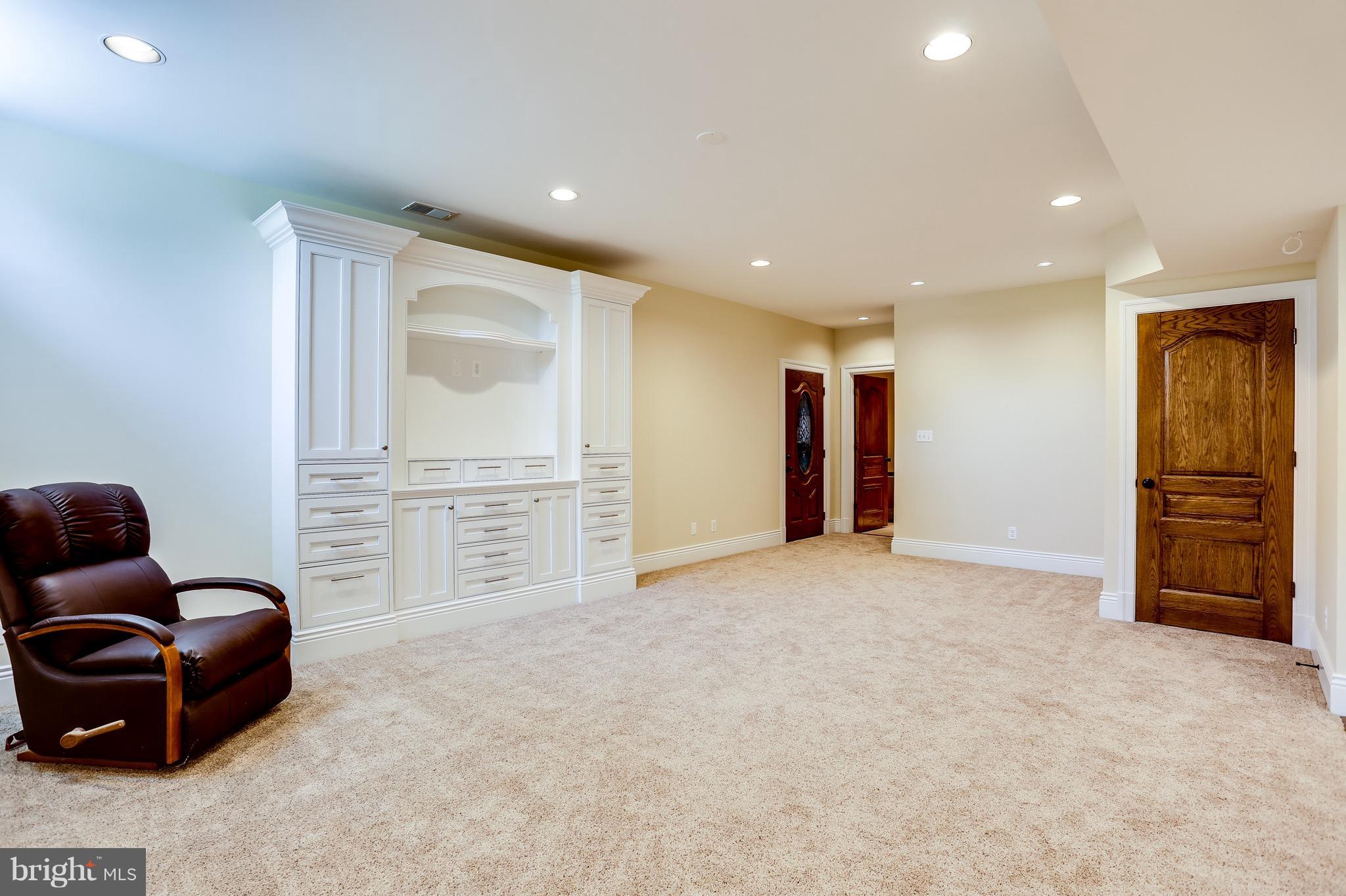 8255 Old Montgomery Road Columbia, MD 21045 - Photo 11 of 29 Theater Area with Custom Cabinets