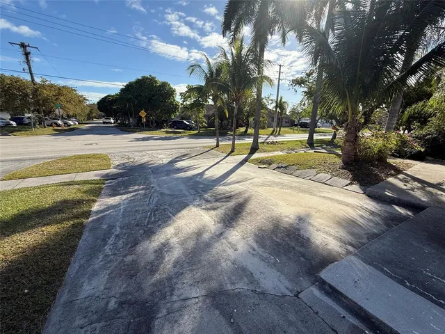 a view of swimming pool with outdoor seating and yard