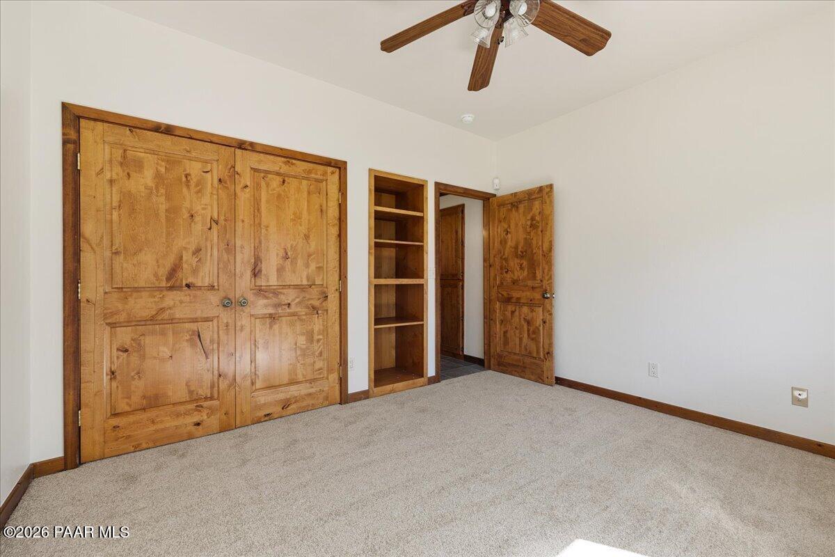 4755 East Lynn Court Lake Montezuma, AZ 86335 - Photo 21 of 36 an empty room with closet area