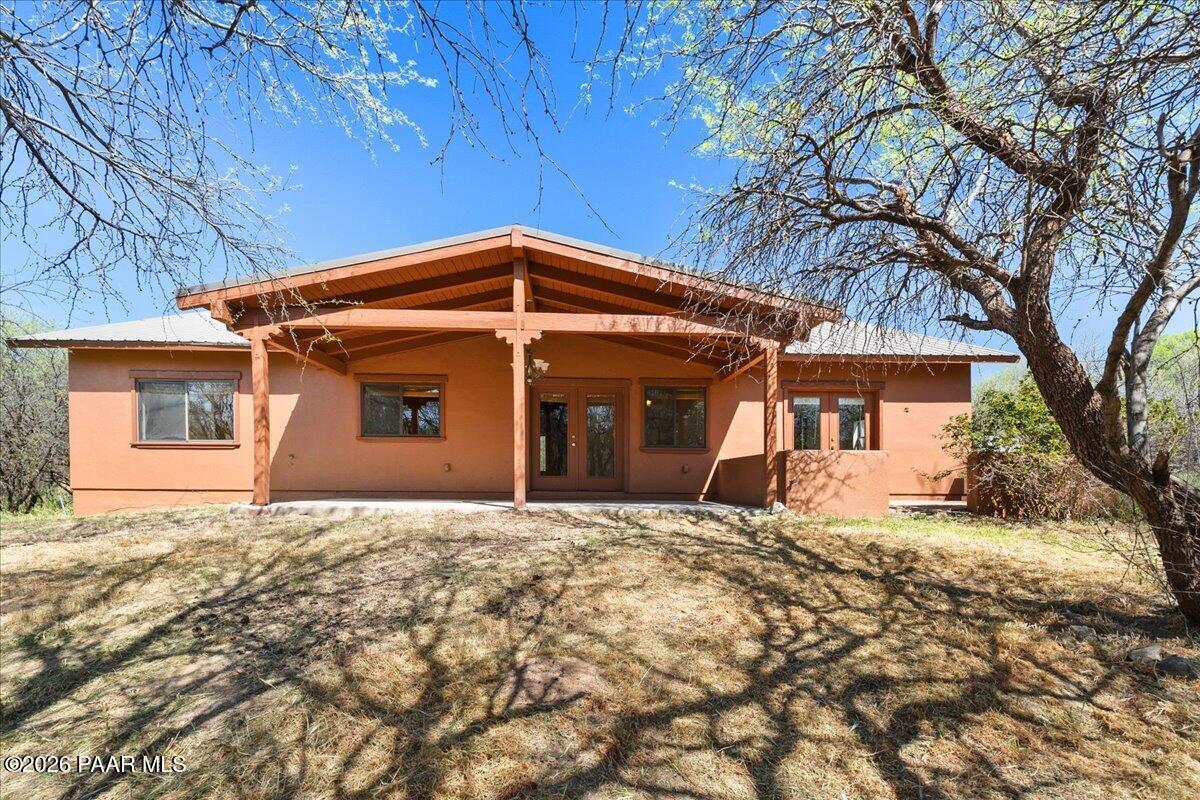 4755 East Lynn Court Lake Montezuma, AZ 86335 - Photo 27 of 36 a front view of a house with a yard and garage